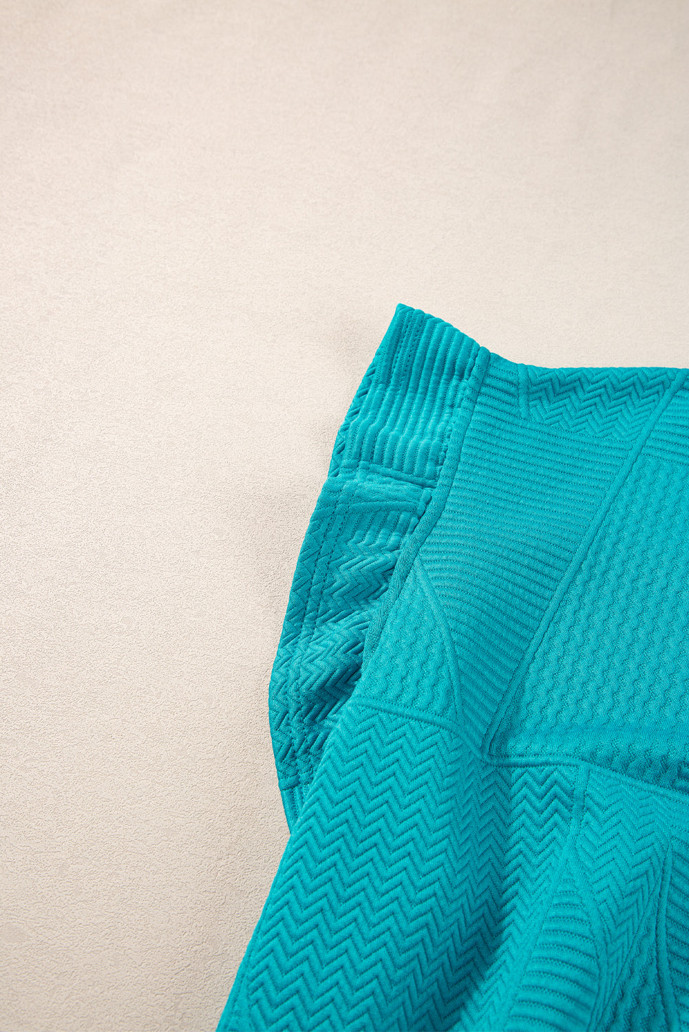 Mommas Hive textured ruffle split top with drawstring shorts, stylish two-piece set in polyester and elastane fabric.
