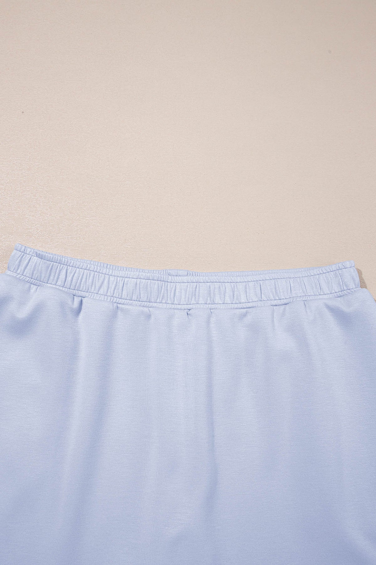 Mommas Hive blue two-piece set featuring puff sleeve pearl-embellished scallop trim top and matching skort, polyester-viscose blend.