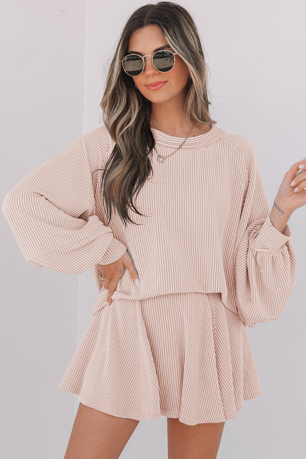 Mommas Hive two-piece set with corded lantern sleeve top and high-waist ruffled mini skirt, polyester and viscose blend.