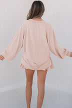 Mommas Hive two-piece set with lantern sleeve top and high-waist ruffled mini skirt, made of polyester, viscose, and elastane.