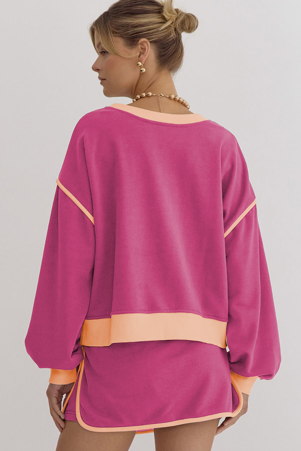 Rose red contrast loose pullover and lace-up waist skort set by Mommas Hive, featuring a relaxed fit and stylish design.