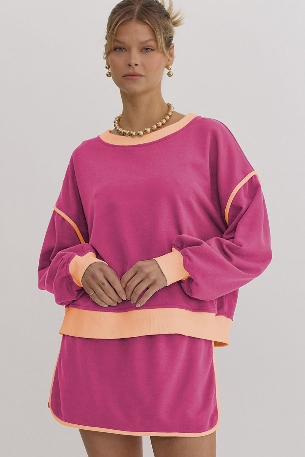 Rose red color contrast loose pullover and lace-up waist skort set from Mommas Hive, two-piece fashion ensemble.