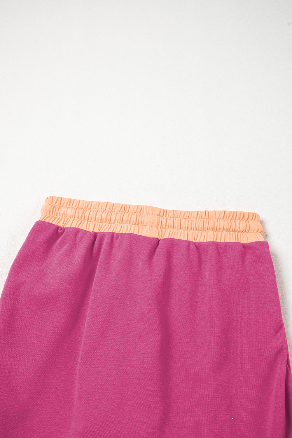 Rose red contrast loose pullover and lace-up waist skort set by Mommas Hive, casual two-piece outfit in polyester and cotton.
