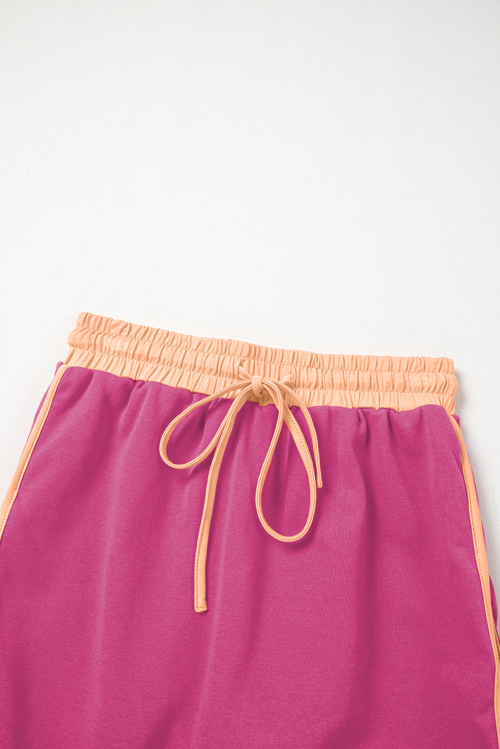 Rose red contrast loose pullover and lace-up waist skort set by Mommas Hive, featuring a casual two-piece dress with polyester and cotton.