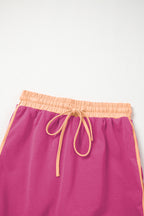 Rose red contrast loose pullover and lace-up waist skort set by Mommas Hive, featuring a casual two-piece dress with polyester and cotton.