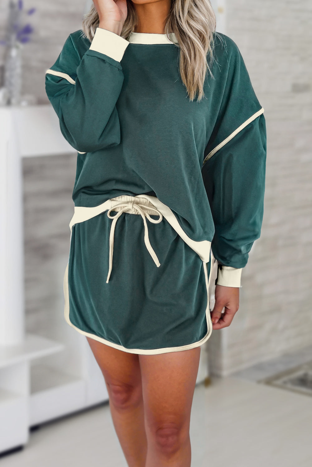 Mommas Hive rose red color contrast loose pullover and lace-up waist skort set, two-piece fashion outfit for casual wear.