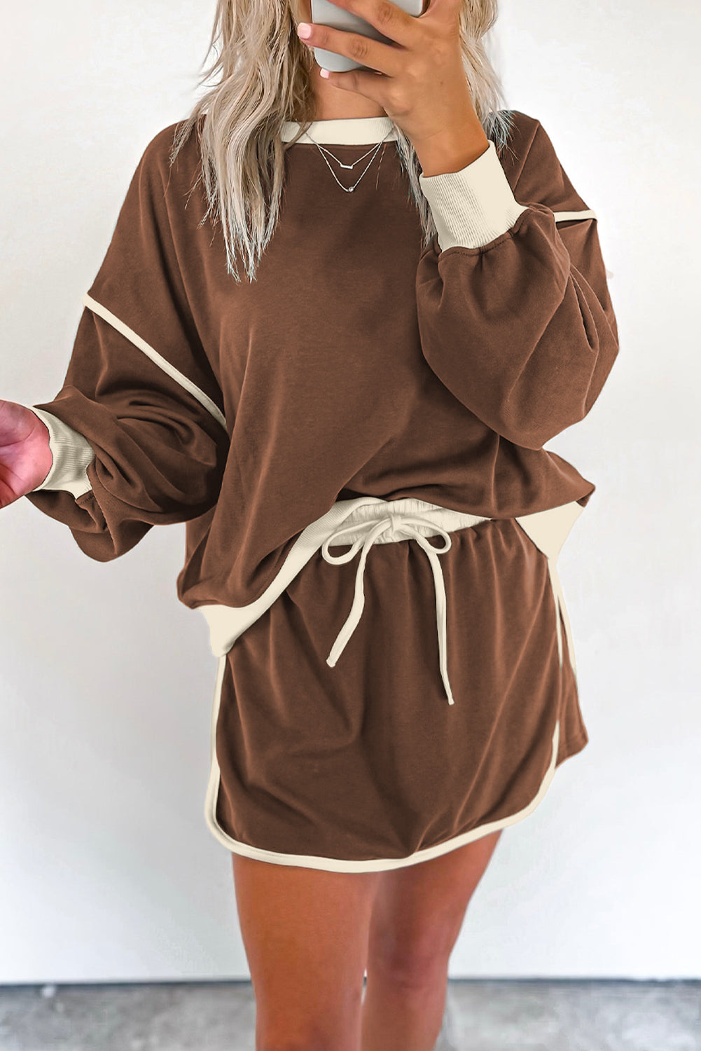 Rose red contrast loose pullover and lace-up waist skort set from Mommas Hive, two-piece dress with polyester and cotton fabric.