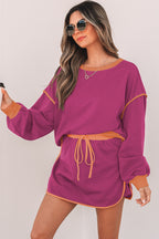 Rose red contrast two-piece set featuring a loose pullover and lace-up waist skort, made by Mommas Hive.