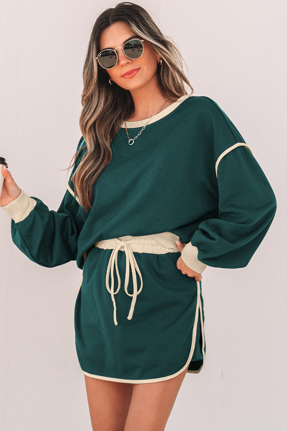 Rose red color contrast loose pullover and lace-up waist skort set by Mommas Hive, featuring a relaxed fit and stylish design.