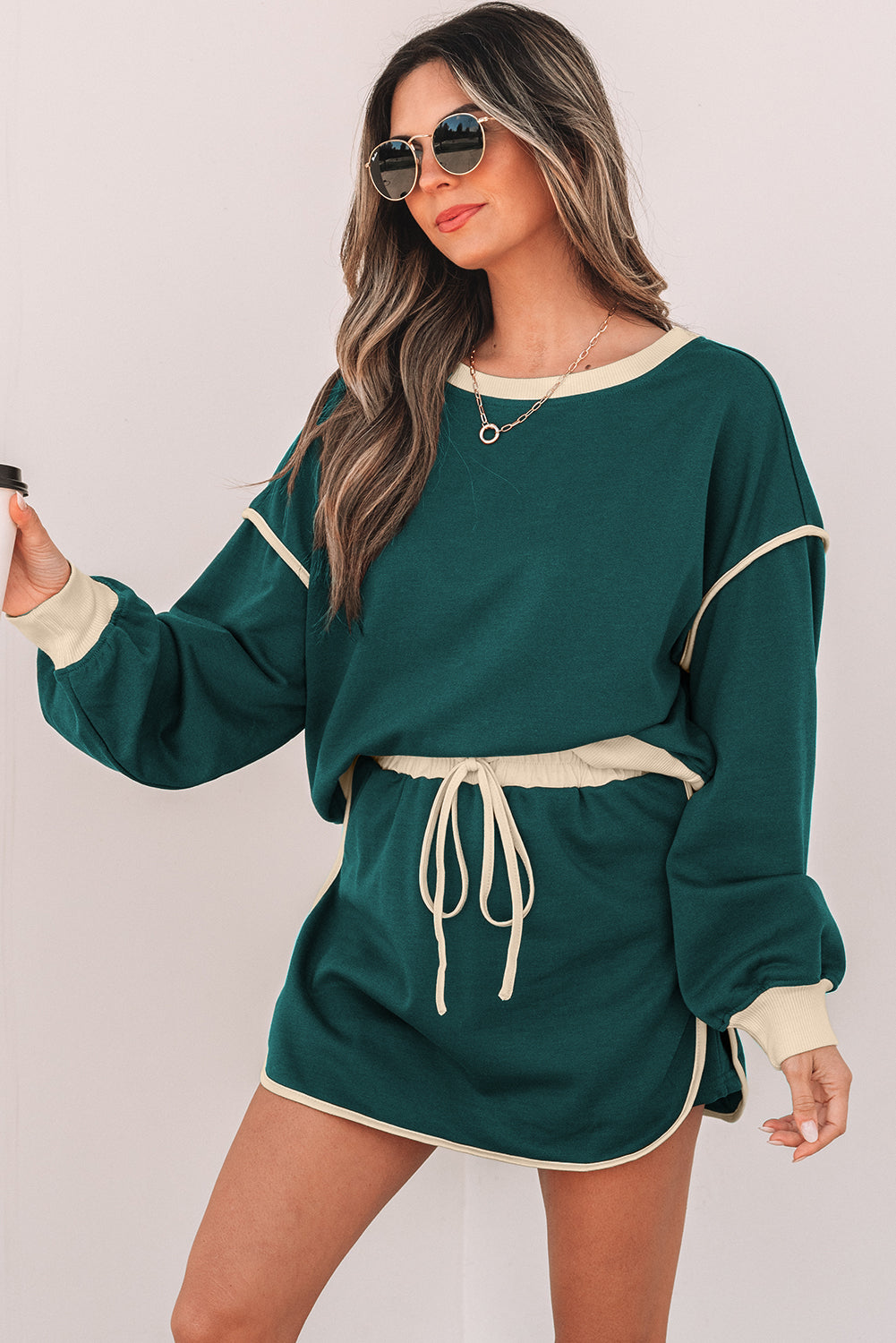 Rose red color contrast loose pullover and lace-up waist skort set by Mommas Hive, featuring a relaxed fit and stylish design.