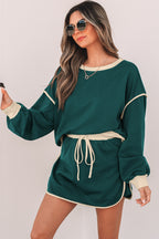 Rose red color contrast loose pullover and lace-up waist skort set by Mommas Hive, featuring a relaxed fit and stylish design.
