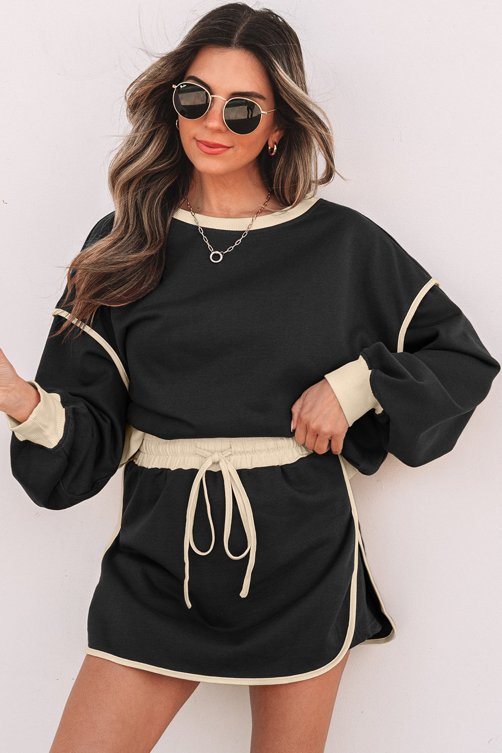 Mommas Hive rose red two-piece set with contrast loose pullover and lace-up waist skort, made of polyester and cotton blend.