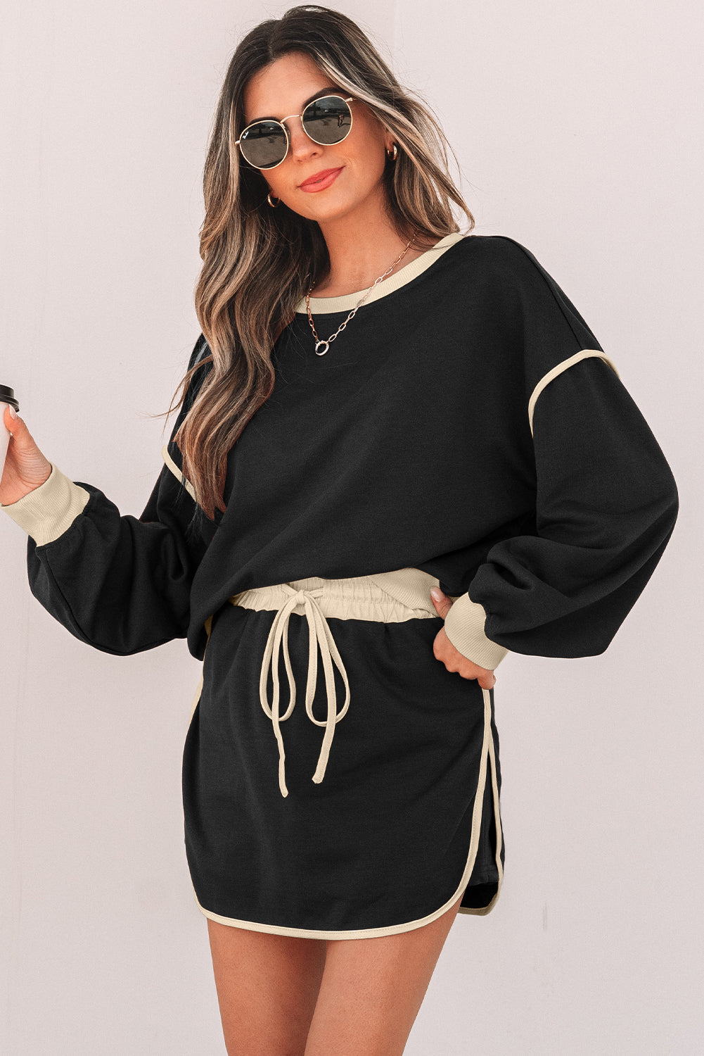 Rose red color contrast loose pullover and lace-up waist skort set from Mommas Hive, styled as a stylish two-piece outfit.