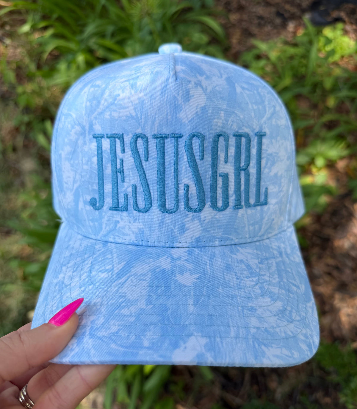 Blue camo RTS JESUSGRL hat by P&PD Wholesale with a curved brim and adjustable strap, featuring bold JESUSGRL lettering.