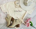 Blue Teacher Floral Embroidered Tee by P&PD Wholesale, featuring colorful floral embroidery on the front.