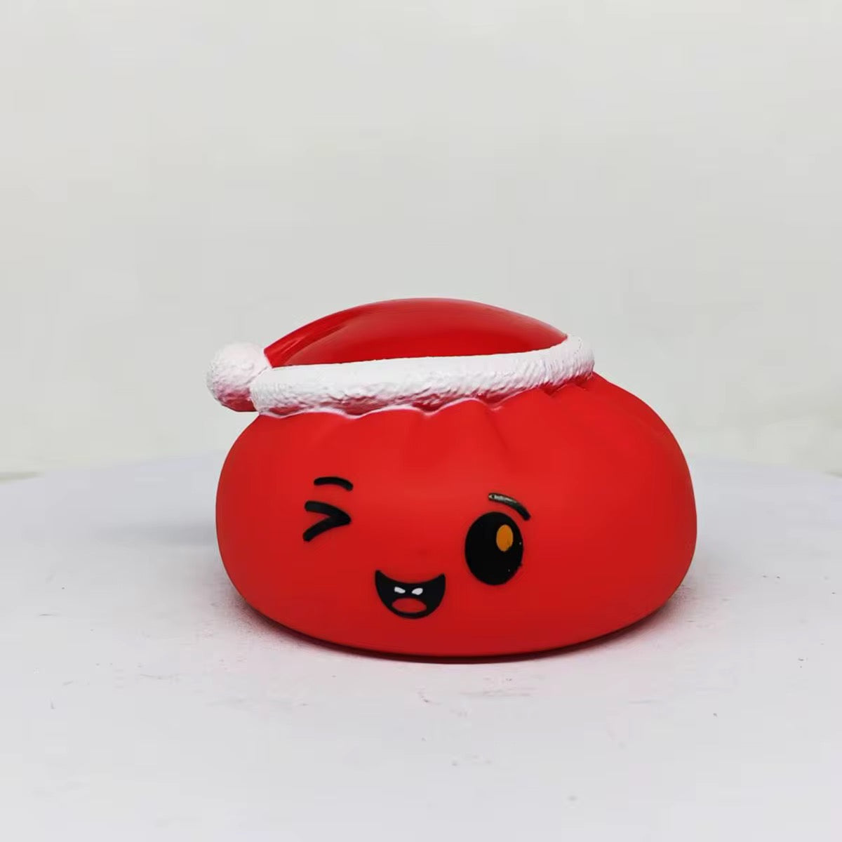 Christmas squeaker dumpling toy from P&PD Wholesale, soft plush with a festive design and squeaker inside.