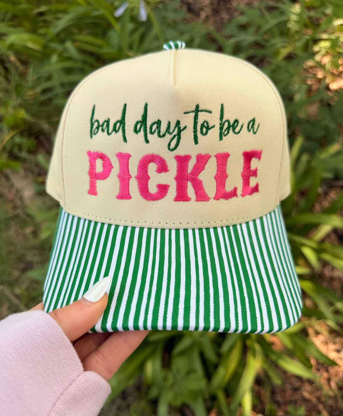 Green striped "Bad Day To Be A Pickle" hat by P&PD Wholesale, featuring playful design and casual style.