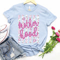 Heather blue Motherhood Floral Stripes Tee by P&PD Wholesale, showing a casual women's t-shirt with floral and stripe patterns.