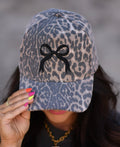 Leopard bow hat with a large decorative bow, stylish accessory from P&PD Wholesale, perfect for adding a trendy touch to outfits.