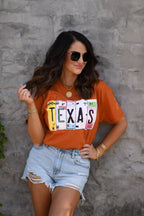 Texas License Plate Tee by P&PD Wholesale featuring a vintage-style Texas license plate graphic on a casual t-shirt.