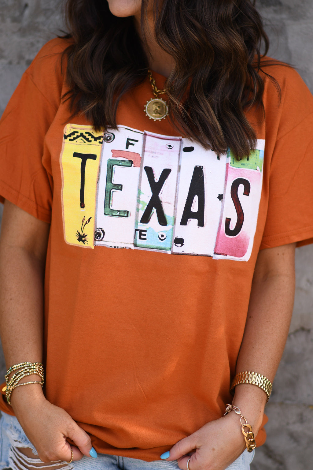 Texas License Plate Tee by P&PD Wholesale featuring a graphic of a vintage Texas license plate on a casual t-shirt.