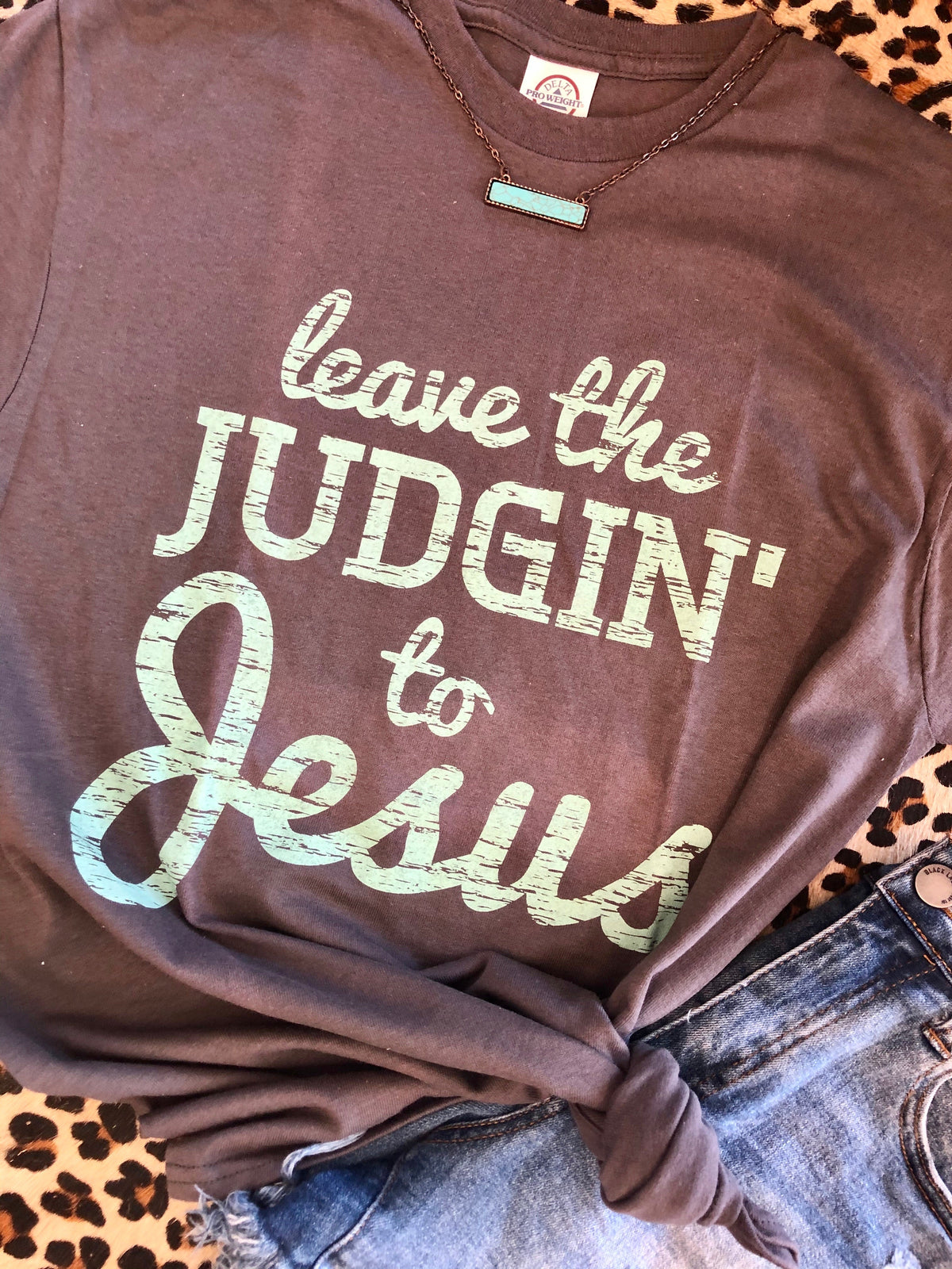 Charcoal-colored ceramic mug with "Leave the Judgin’ to Jesus" printed in bold text, designed by P&PD Wholesale.