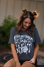 Black men's T-shirt from P&PD Wholesale with bold "Do No Harm But Take No Shit" slogan, casual fit, and comfortable fabric.