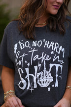Black Do No Harm But Take No Shit T-shirt from P&PD Wholesale featuring bold white text on the front.