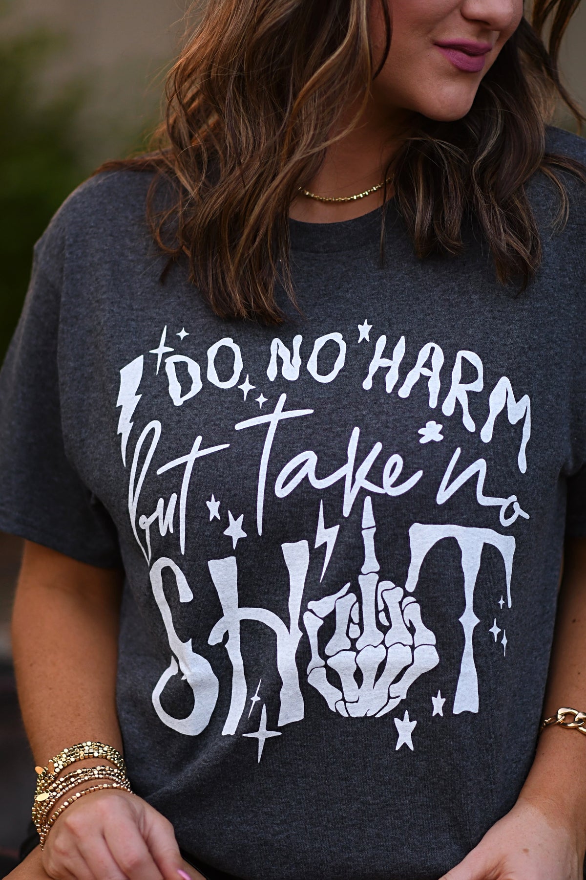 Black Do No Harm But Take No Shit T-shirt from P&PD Wholesale featuring bold white text on the front.