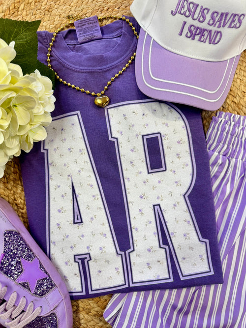 Purple floral state T-shirt by P&PD Wholesale featuring a vibrant floral design on a casual tee.