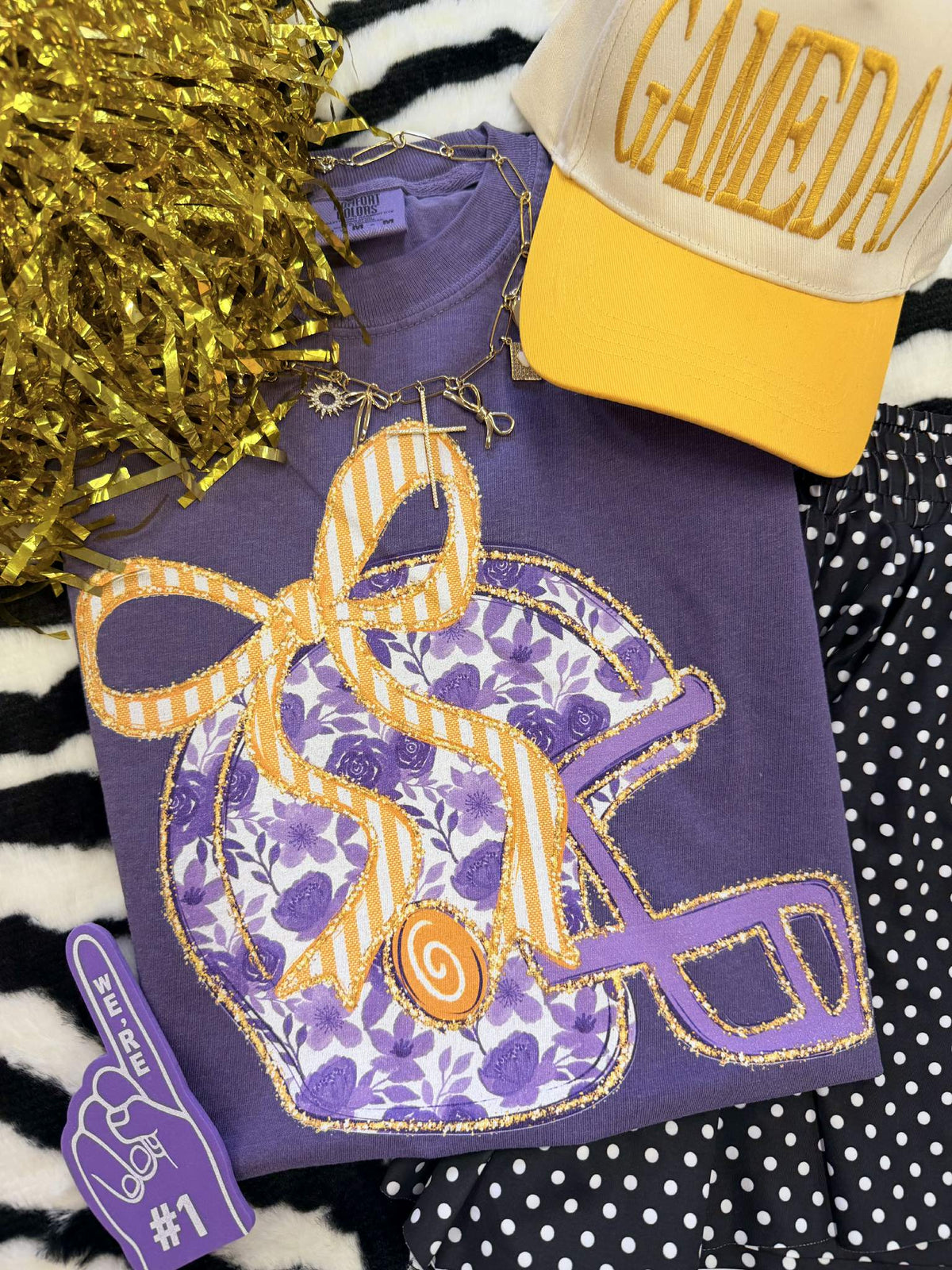 Purple floral helmet T-shirt by P&PD Wholesale featuring a vibrant floral design on a casual tee shirt.
