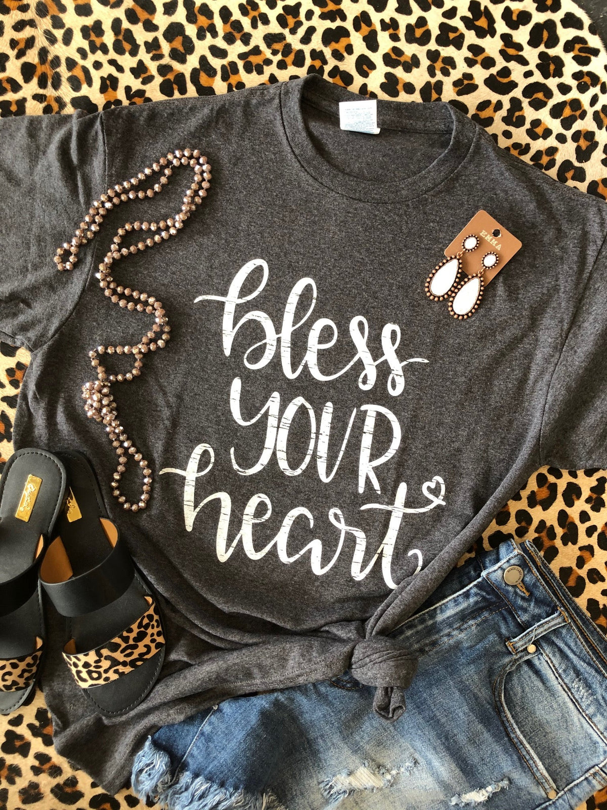Heather charcoal "Bless Your Heart" sign by P&PD Wholesale, featuring bold lettering on a rustic wooden background.