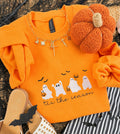 Orange embroidered sweatshirt with ghost design from P&PD Wholesale, featuring festive "Tis the Season" text and cozy fabric.