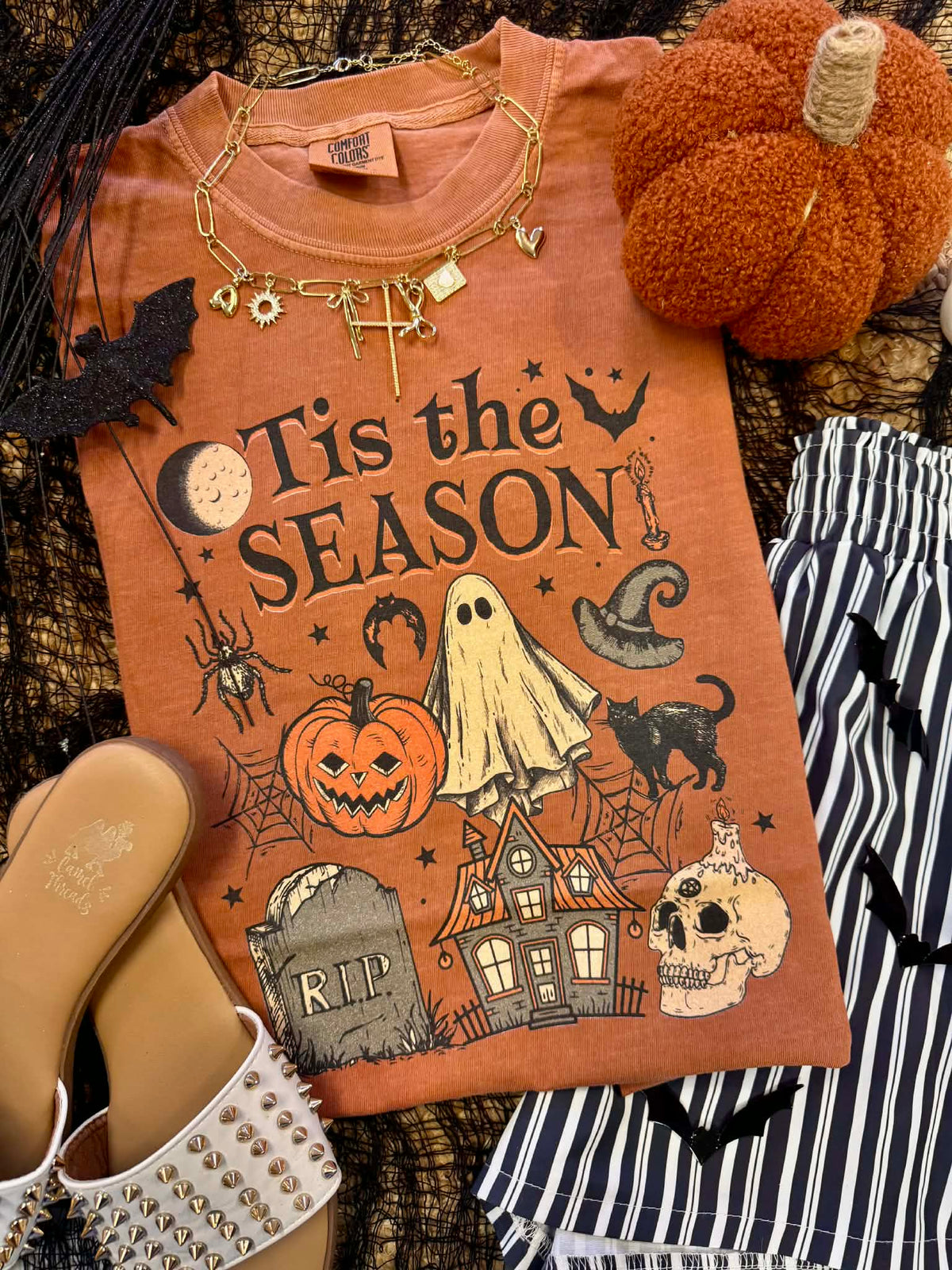 P&PD Wholesale Tis the Season Halloween T-shirt with festive holiday design and seasonal graphics on black fabric.