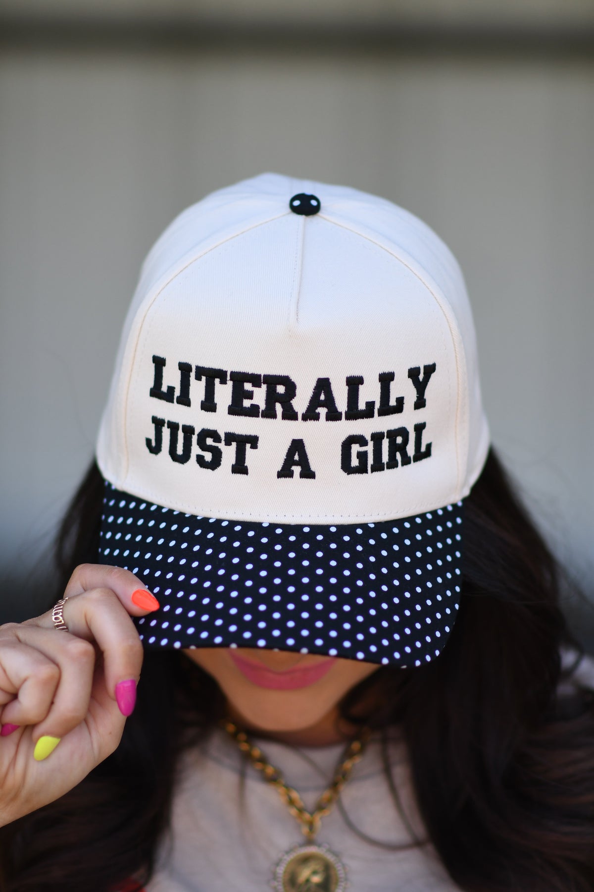 Small black polka dot hat from P&PD Wholesale, featuring a charming "Literally Just A Girl" design and stylish casual accessory.