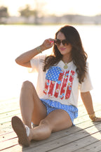Small floral swatch flag T-shirt from P&PD Wholesale featuring a colorful floral pattern on lightweight fabric.