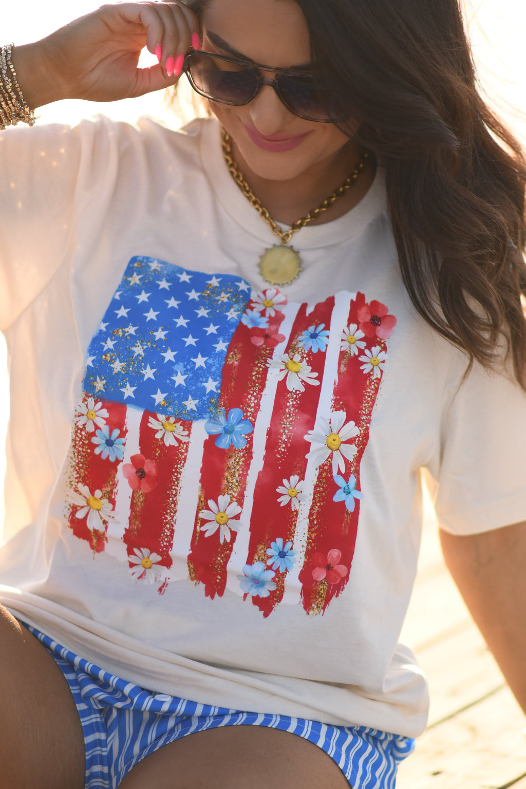 Small floral swatch flag tee from P&PD Wholesale featuring a colorful floral pattern on a casual T-shirt.