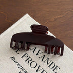 White iridescent RTS hat clips by P&PD Wholesale, shown attached to a hat for secure, stylish accessory display.