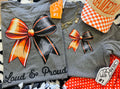 Deep heather orange Bow Tee by P&PD Wholesale featuring bold "Loud & Proud" text on a casual t-shirt.