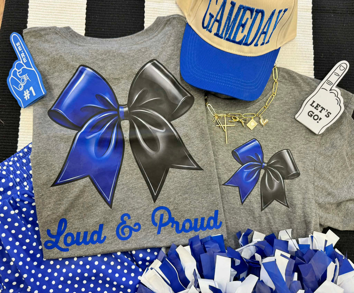 Heather blue LOUD AND PROUD Bow TEE by P&PD Wholesale, front view showing the graphic design and casual fit.