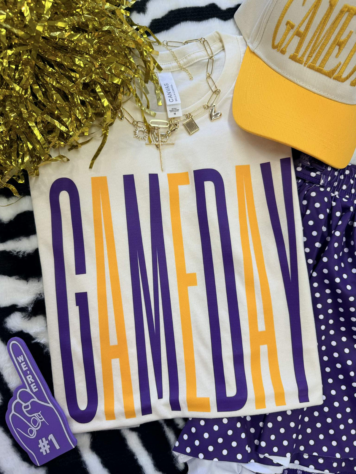Tall purple and gold Game Day Tee by P&PD Wholesale, featuring a comfortable fit and vibrant team colors.