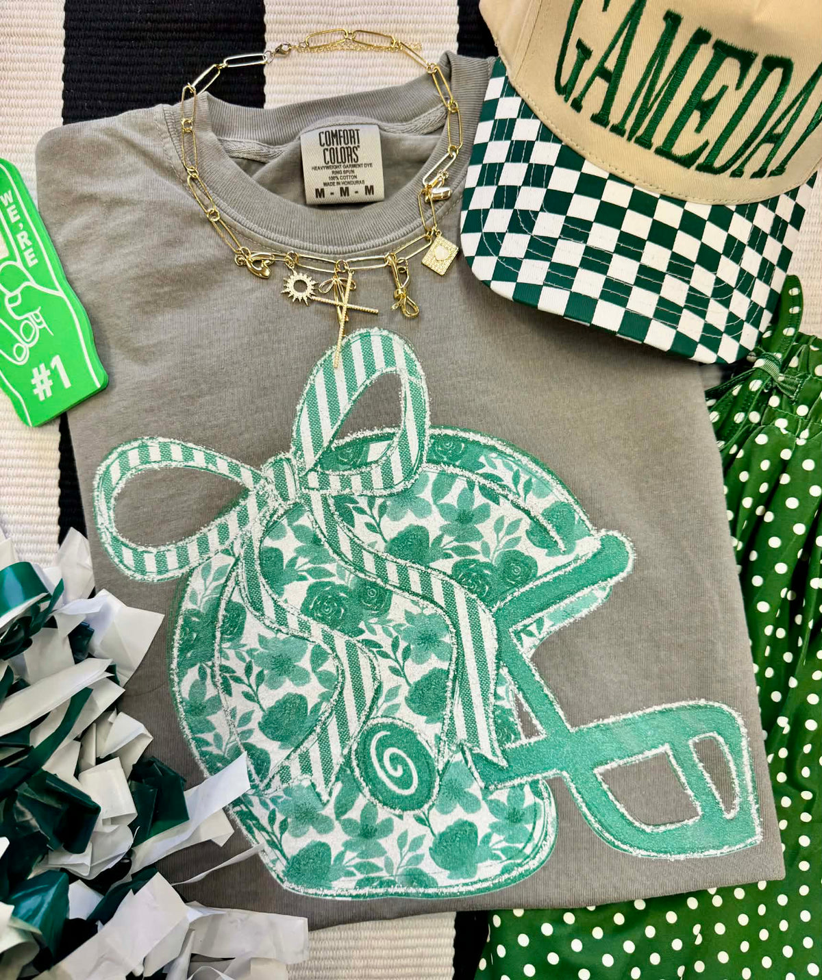 Green floral helmet tee from P&PD Wholesale featuring a casual design and comfortable fabric, ideal for everyday wear.