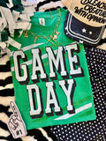 Heather Kelly green P&PD Wholesale Game Day Stripes Tee showing the green and white striped design on a casual t-shirt.