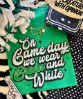Heather Kelly green T-shirt from P&PD Wholesale with "On Gameday We Wear Green and White" text, casual and comfortable fit.