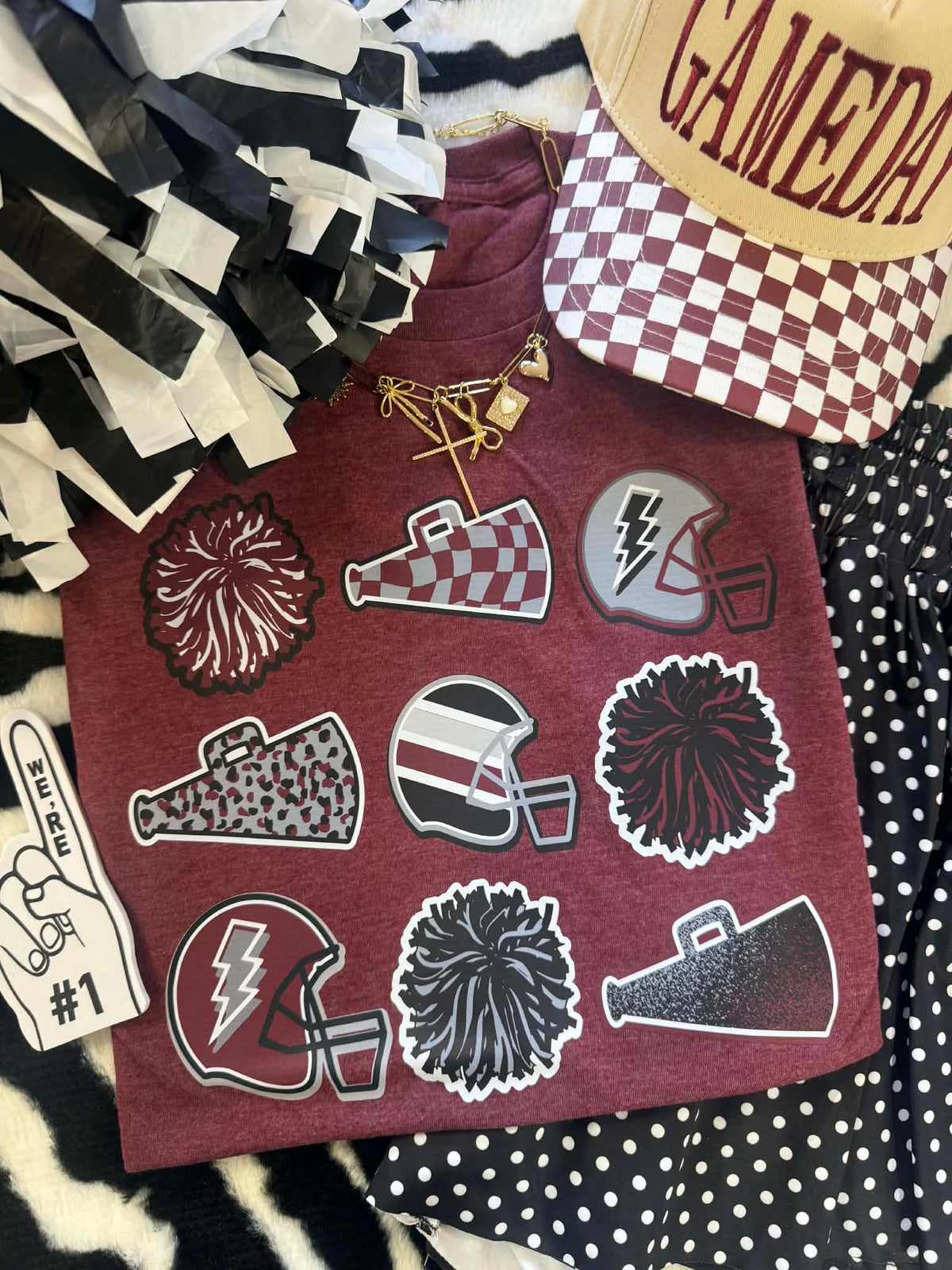 Maroon football icons T-shirt by P&PD Wholesale, Heather maroon color, casual fit, featuring football graphic design.