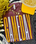 Tall white and gold Gameday Maroon tee by P&PD Wholesale, heather maroon fabric with white and gold accents.