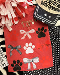 Heather red Paws & Bows T-shirt for kids from P&PD Wholesale, featuring playful paw and bow graphic on the front.