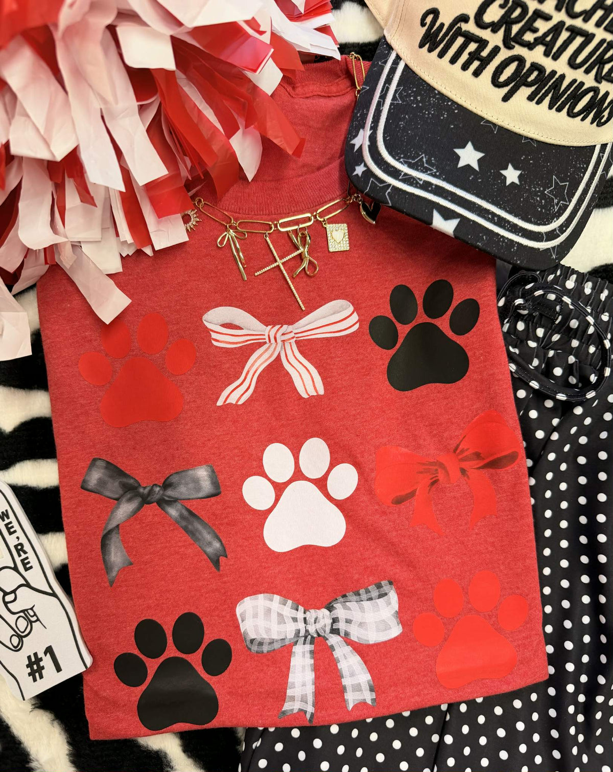 Heather red Paws & Bows T-shirt for kids from P&PD Wholesale, featuring playful paw and bow graphic on the front.