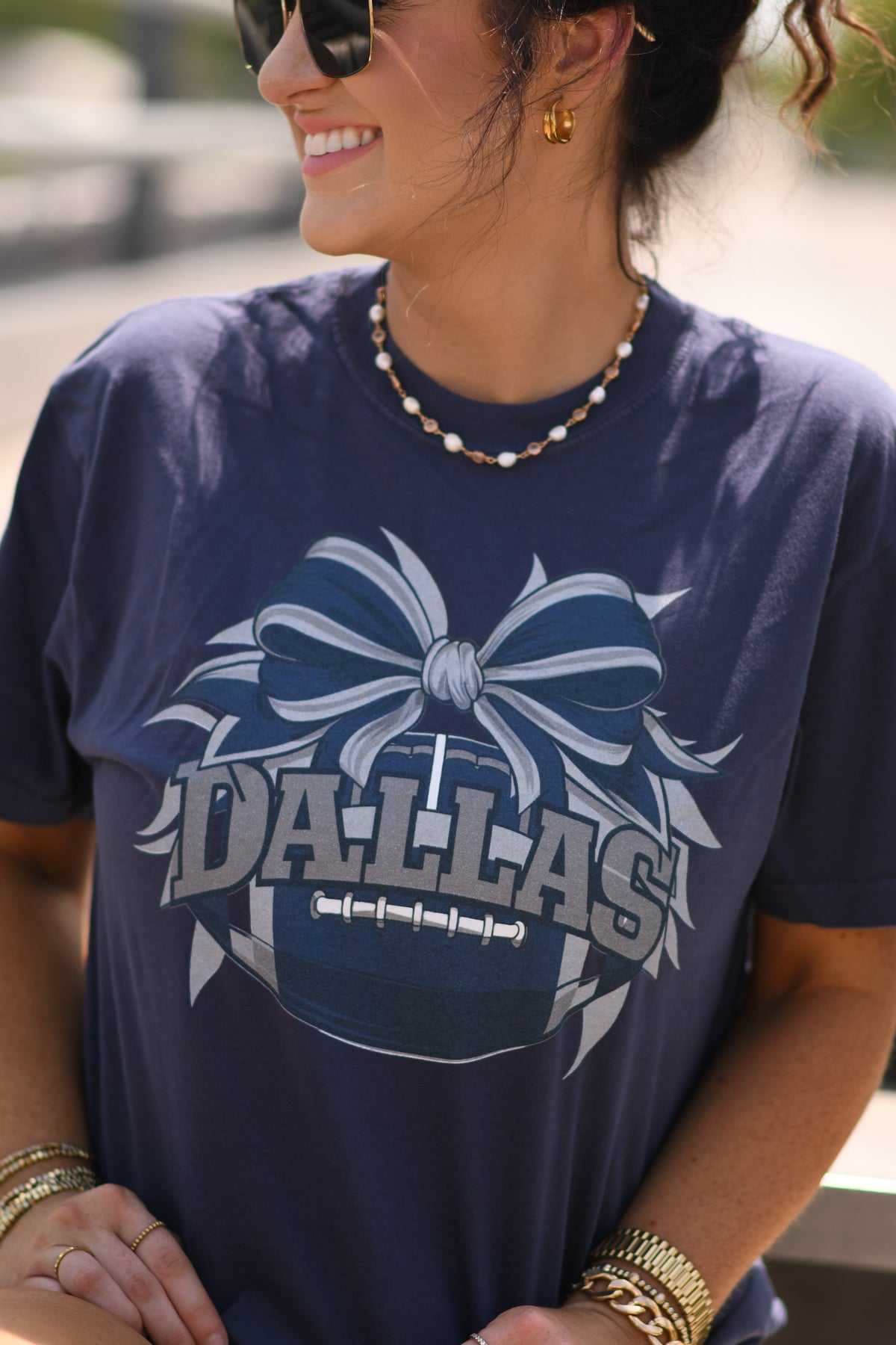 Navy Dallas Football Bow Tee by P&PD Wholesale, featuring a casual T-shirt with a football graphic and bow detail for kids.