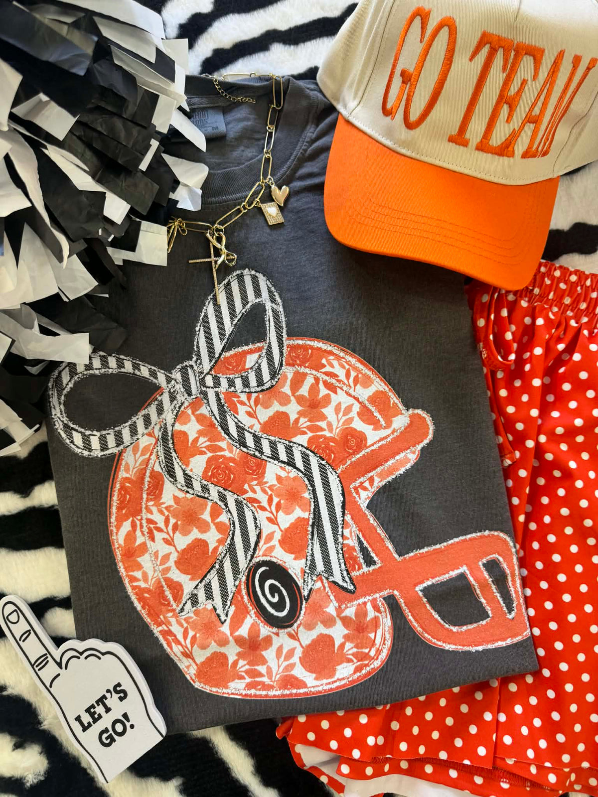 Orange floral helmet t-shirt by P&PD Wholesale featuring vibrant floral print and casual fit, displayed on a plain background.